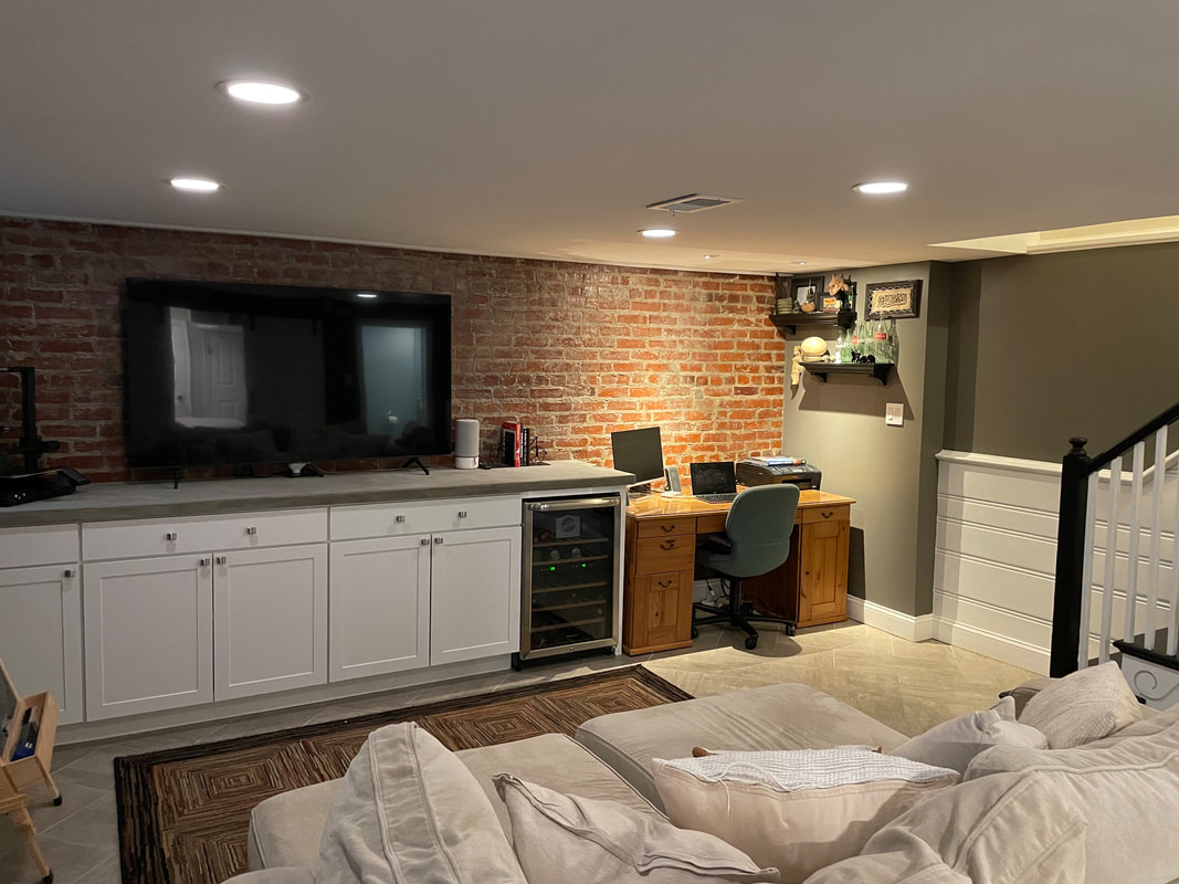 Finished basement with exposed brick