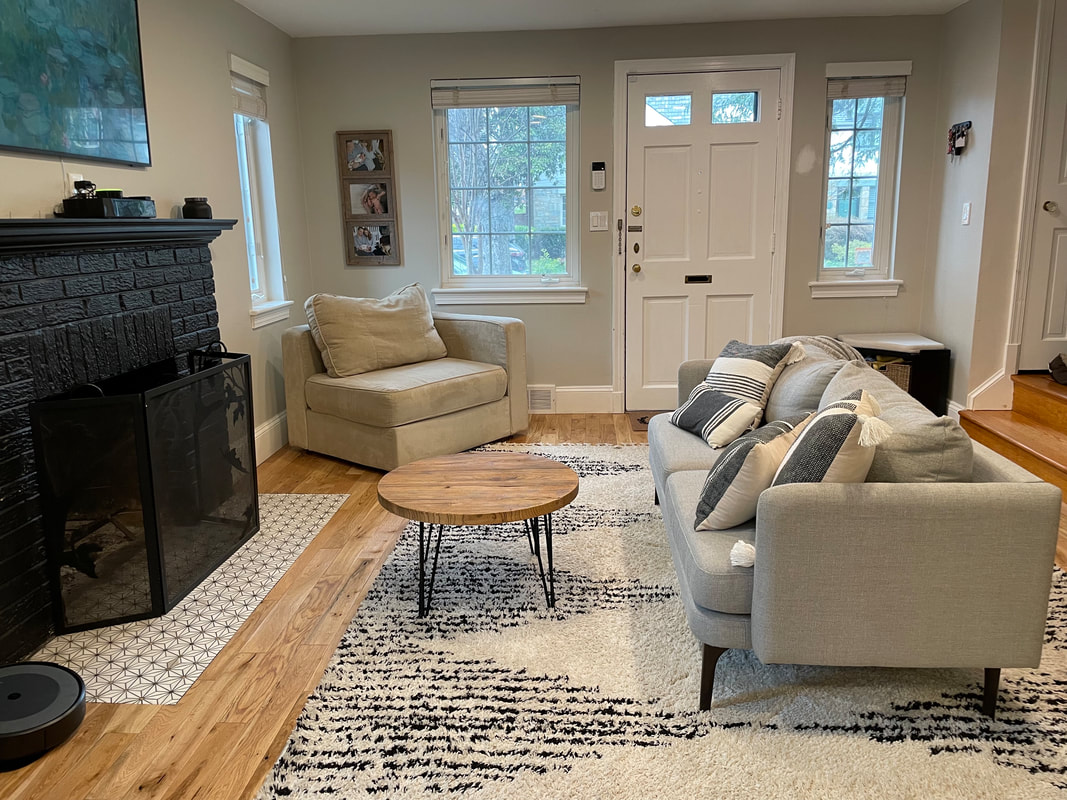 Open living room with fireplace and hardwood floors