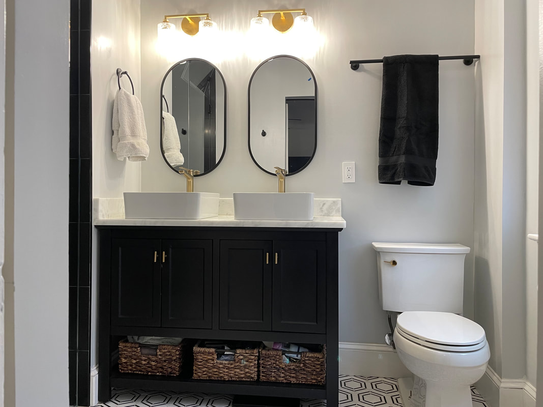 Double-vanity master bath with brass fixtures
